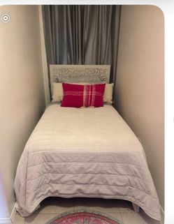 Twin Boho Carved Medallion Bed Frame with headboard and mattress.