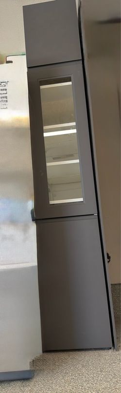 Grey kitchen cabinets with glass door