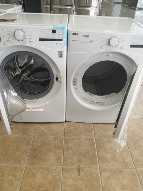 LG brand new open box front loater white ready to deliver,,no scratches...NO dent...