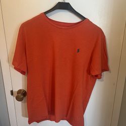 Polo By Ralph Lauren. Bold Orange Polo t-shirt with classic branding. Ideal for casual outings. Mint Condition . Best offer.