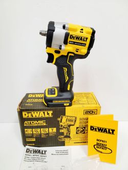 DeWalt Atomic 20V Max brushless 3/8-inch impact wrench, model DCF923. This yellow power tool has a maximum fastening torque of 300 ft-lbs and a maximu