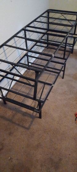 2- fold up twin bed frames.