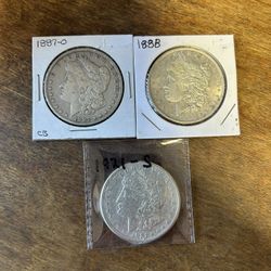 Three Morgan Silver Dollars. Group 13.