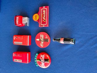 Collection of seven vintage Coca-Cola refrigerator magnets
