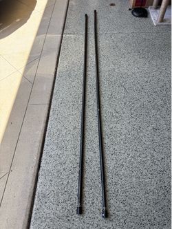 FREE — Two black and bronze extendable curtain rods