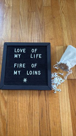 Black letterboard with all letters and symbols