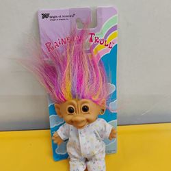 Vintage 1990s Bright of America Rainbow Troll doll features multicolored hair and is packaged with a white onesie covered in a colorful alphabet patte