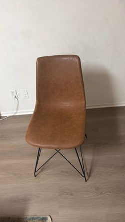 Brown faux leather chair