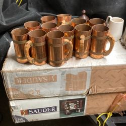 These are 12 copper mugswooden handles. 