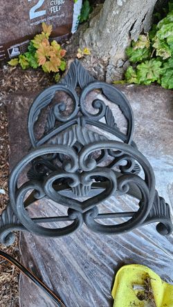 Garden hose wall holder