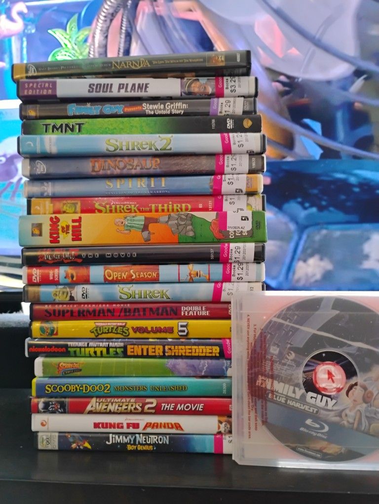 Stack Of DVDs Plus 1 Blu-ray