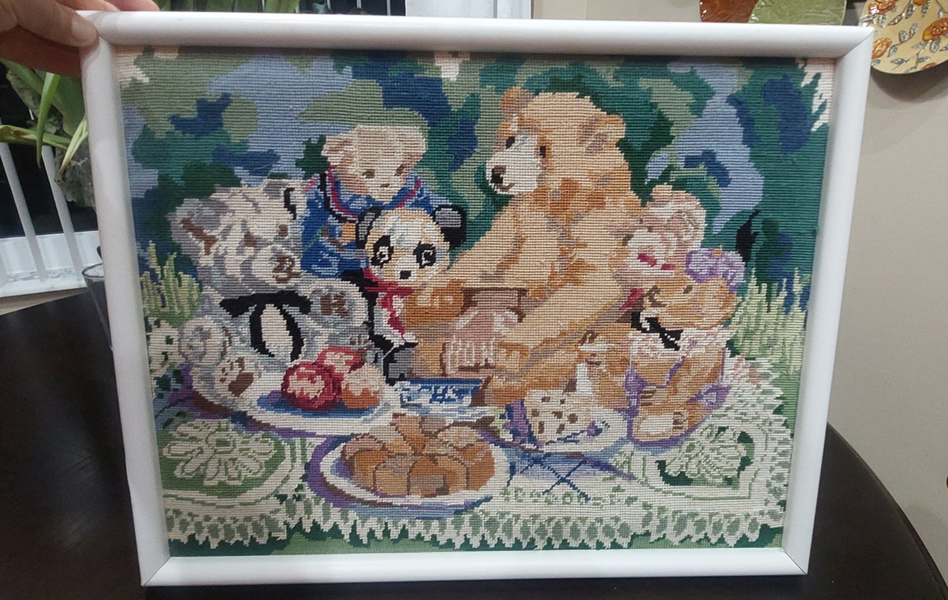 vintage needlepoint / cross-stitch embroidery piece depicting a teddy bear picnic scene
