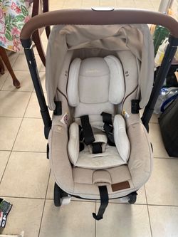 Evenflo Shyft DualRide Infant Car Seat and Stroller Combo with Green & Gentle Fabric, Champagne