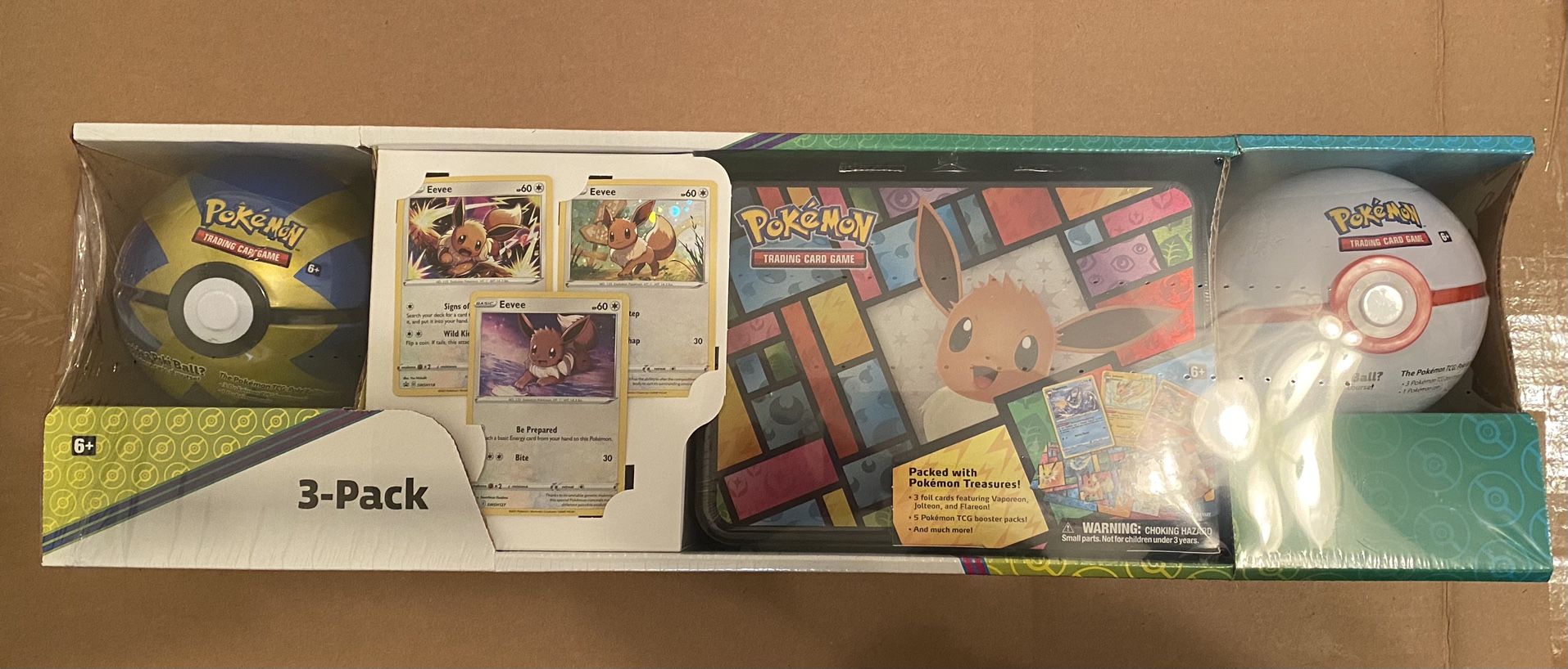 Pokemon  Cards 3-Pack Treasure Chest and 2 Poke Ball Tins From Costco