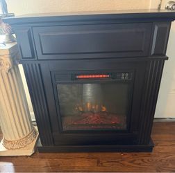 Freestanding electric fireplace with remote