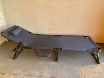 Black folding lounge chair with