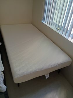 Twin memory foam mattress with frame....( Brand New)