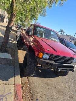 Lifted Red Toyota Pickup