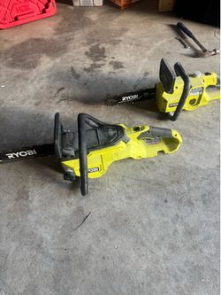 Two Ryobi electric chainsaws