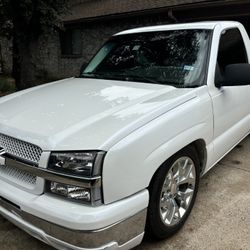 2003 Chevrolet Silverado. With Custom Three Stage Pearl White With Blue Flakes In The Paint.