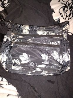 New black crossbody bag with white leaves