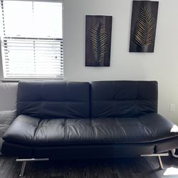 Leather Euro Lounger And Metal Wall Art