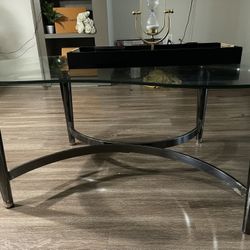 Clear glass coffee table with two matching side tables included. 