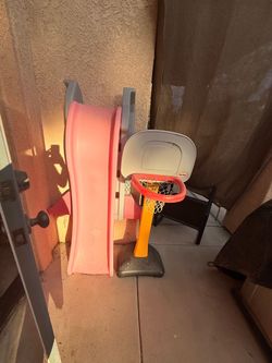 Pink slide and basketball hoop