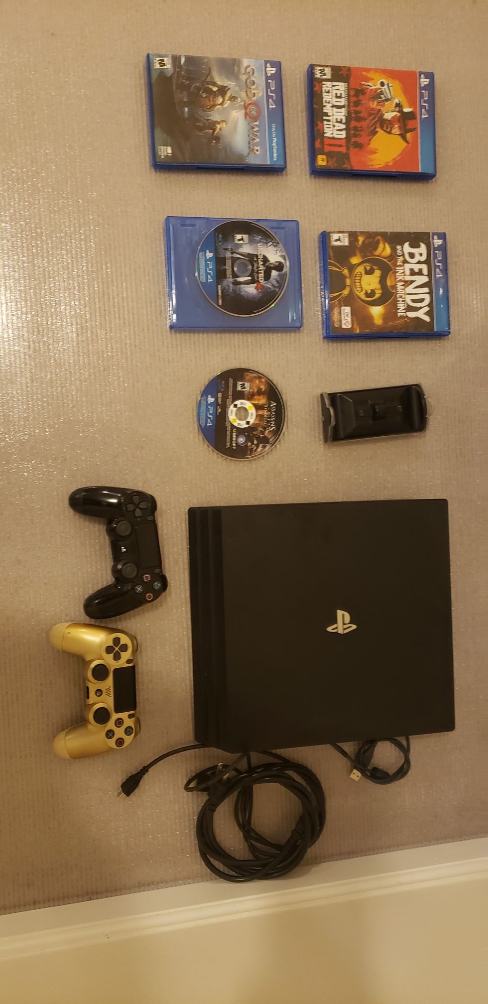 Sony PS4 Pro + 5 games+ dual charging station with 2 gaming controllers