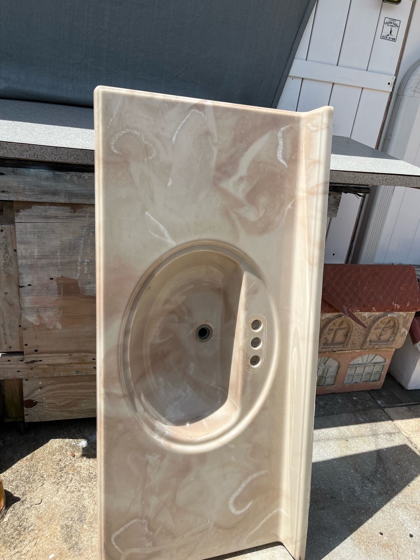 Washbasin with its vanity cabinet—very beautiful and in good condition. Bone-beige color with veining; measures 49 x 22 inches.