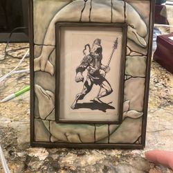 Native American warrior with porcelain dolphin outside