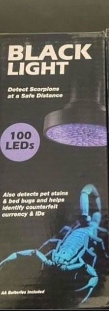 Heavy duty, metal case black light with batteries and strap Heavy duty, metal case black light with batteries and strap