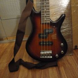 Bass Guitar (New, Barely used) with New Cord And Guitar Cover Included and Free Horse 