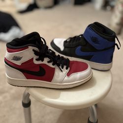 Two Pairs Of Jordan Mids 