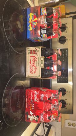 Vintage classic six pack Coca-Cola bottles dating all the way back to 1800 really cool collection