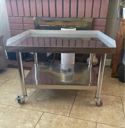 New Stainless Steel table with wheels