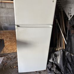 Nice apartment size refrigerator about 58 inches tall 24 inches wide