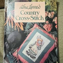 Adorable Alma Lynne’s Country Cross Stitch Hard Cover Book