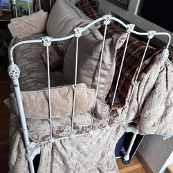 Antique rod iron crib that turns into daybed