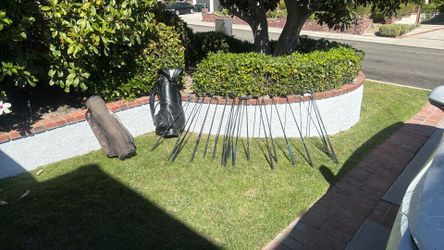 Assorted Golf Clubs And 2 Bags 