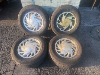 Ford Windstar 15-inch aluminum wheels and caps with old tires 5x108mm