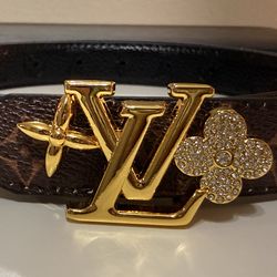 Brown monogram-style belt with gold buckle