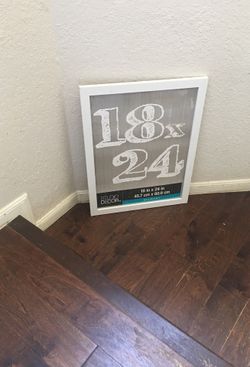 White finished wood frame brand new with its glass