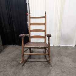 Brown Ladder-Back Rocking Chair with Woven Seat