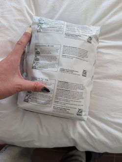 Two bags of Costco cat litter unopened.
