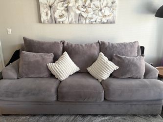 Comfy single gray couch.