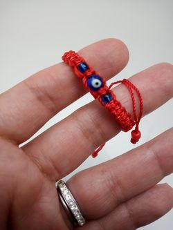 Red bracelet evil eye protection