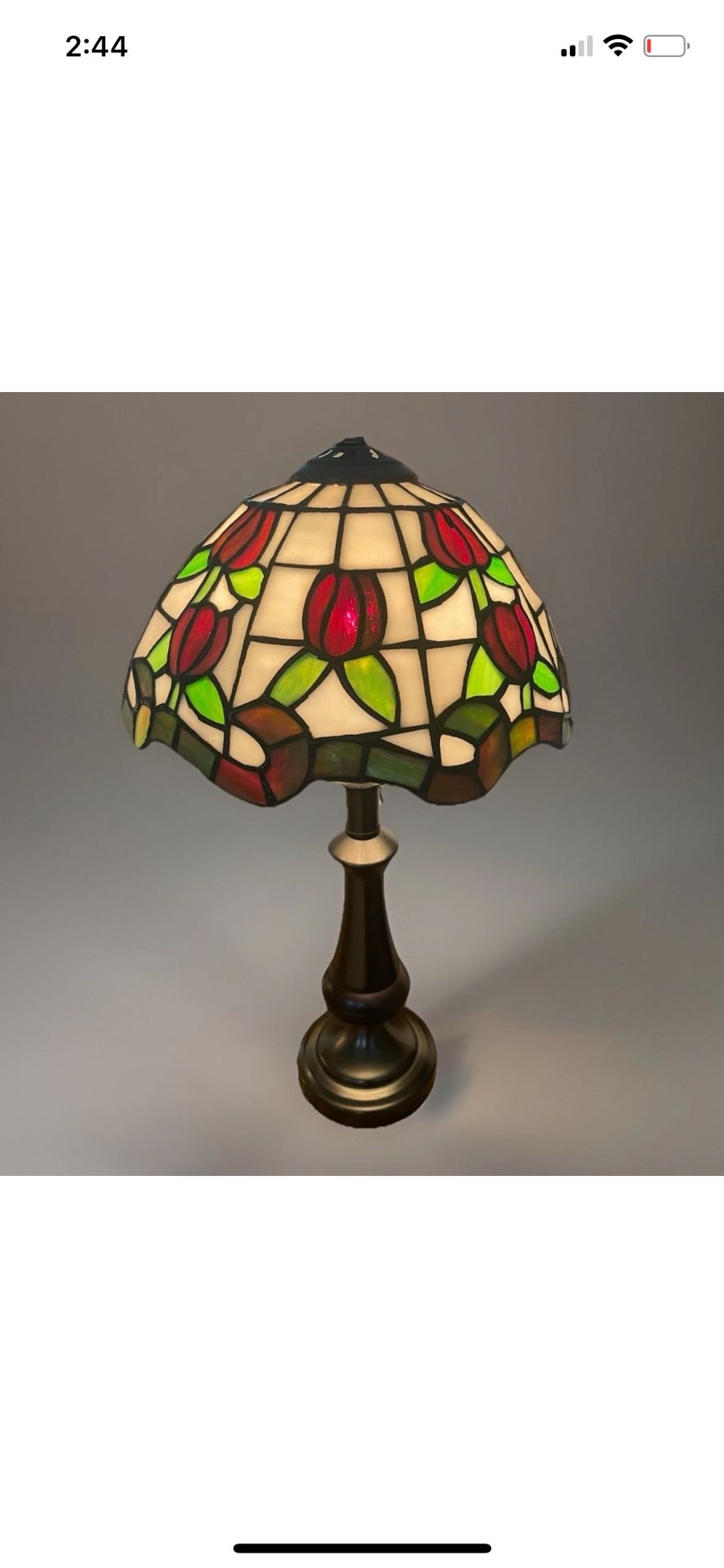 This Vintage Tiffany Style Stained Glass Shade Desk Table Lamp is a colorful and unique addition to any workspace. The lamp features a multicolor des