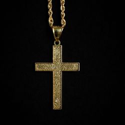 10K yellow gold cross pendant on a matching rope