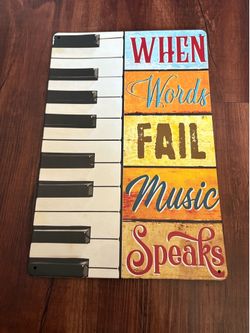 When words fail music speaks tin sign